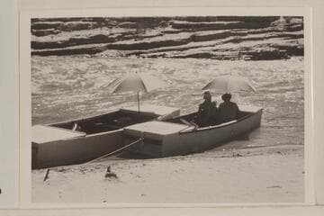 The Frost punts; San Juan River at Mexican Hat. Skipper Frost faces the camera and Robert L. Gates has back to the camera. Second trip of the season