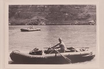 Harry Aleson (near) and Harry Pete Sparkes, Jr., at Green River, Wyoming. The neoprene boats are the 10-man Navy craft