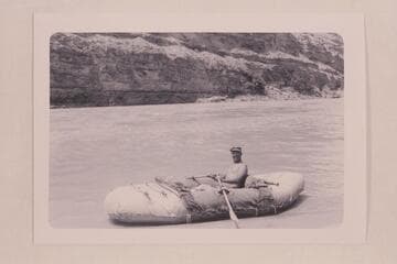 Bill Davis in his canvas-covered neoprene inflated boat. Davis writes: In this I carried all food and equipment and a passenger, except no passenger in Badger, and we lined Hance. The boat is packed as shown, waiting for the passenger