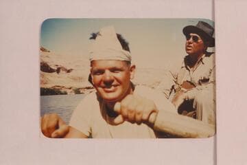 Boatman George Wing at the oars. Max Krueger in background. Max was regional geologist for Union Oil