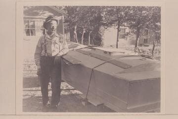 The 79-year-old Bert Loper stands by his boat at his home in Greenriver, Utah, the night before leaving on his fatal trip into the Grand Canyon. He died at Mile 24 1/2 in Marble Canyon on July 8