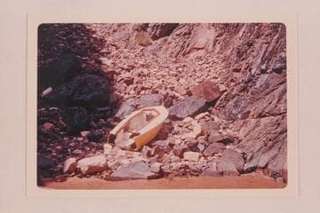 The wrecked "Donz," Don Harris's boat, below Hance Rapid. The boat was wrecked by the rough water in Hance Rapid, but there were no casualties