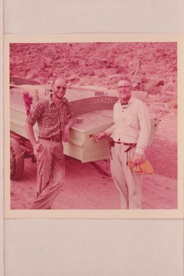 Ed Nichols and Ed Hudson with the inboard boat "Finally"; Lees Ferry after completion of run from Glenwood Springs, Colorado. The tripod on the stern is a camera rig